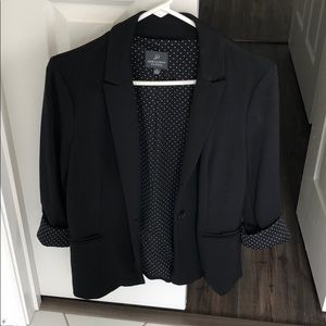 Black blazer with white polka dot liner